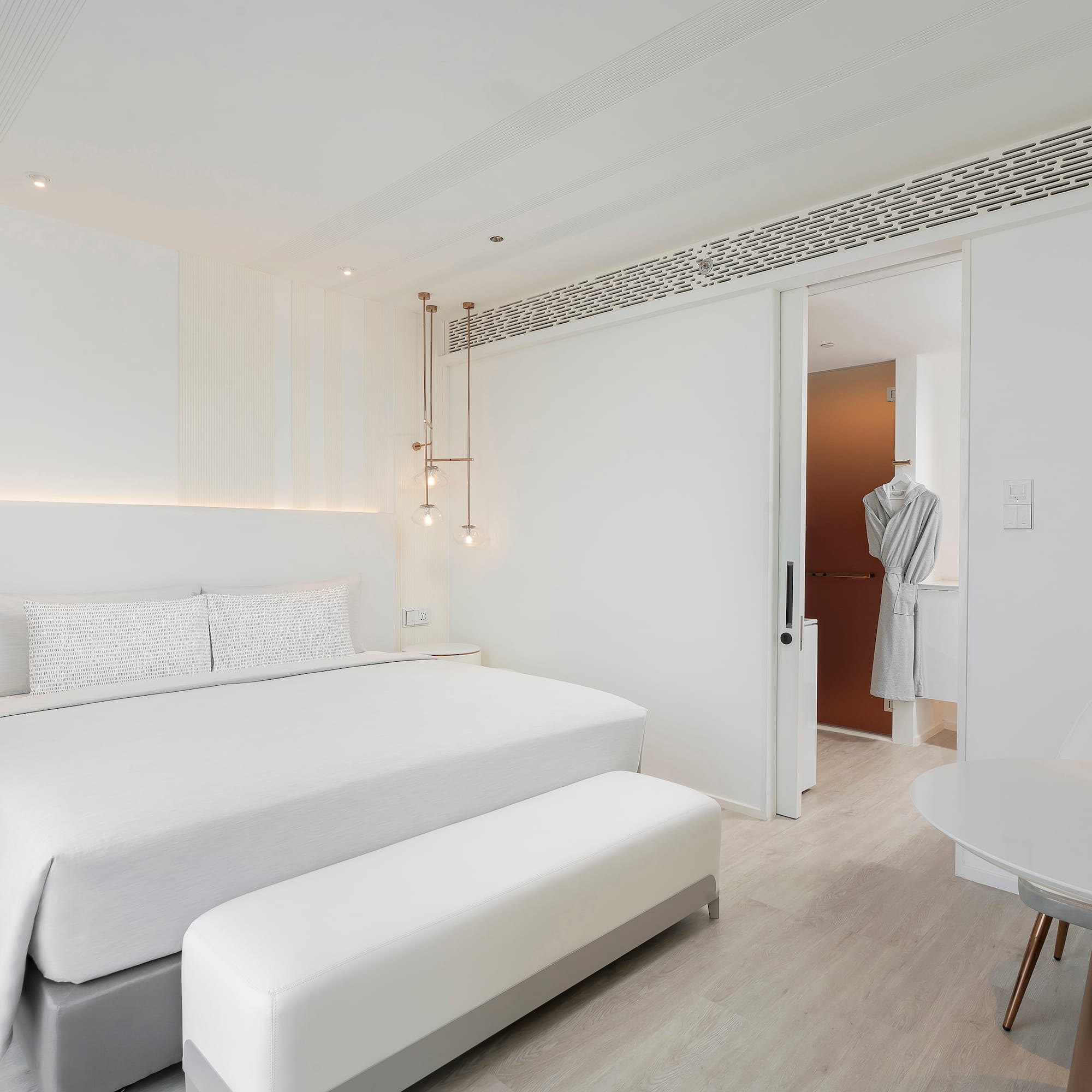 a bedroom with a bed and a table