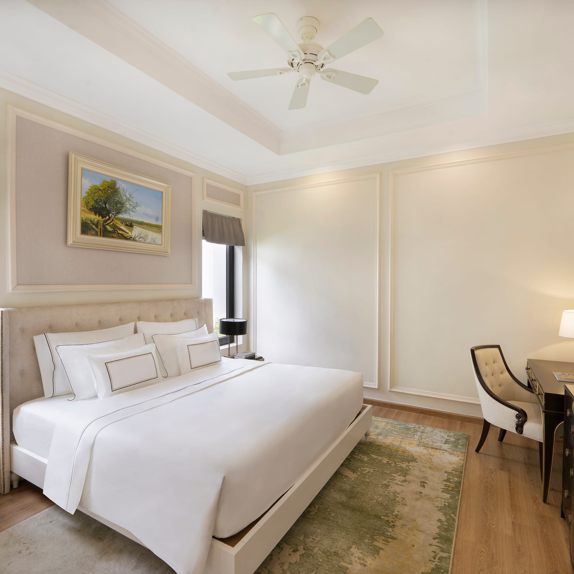 a room with a bed and desk