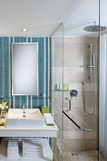 a bathroom with a shower and a sink