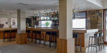 a bar with a shelf of liquor