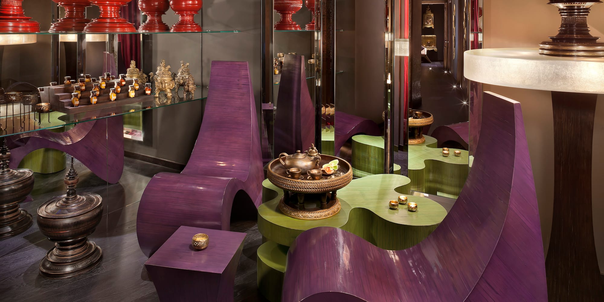 a room with purple chairs and a table