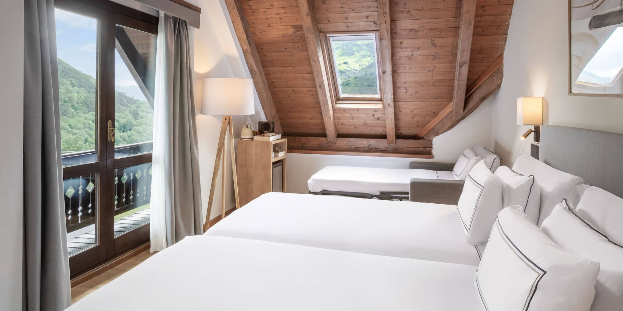 a room with a wooden ceiling and a window