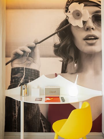 a poster of a woman holding a flower on a stick