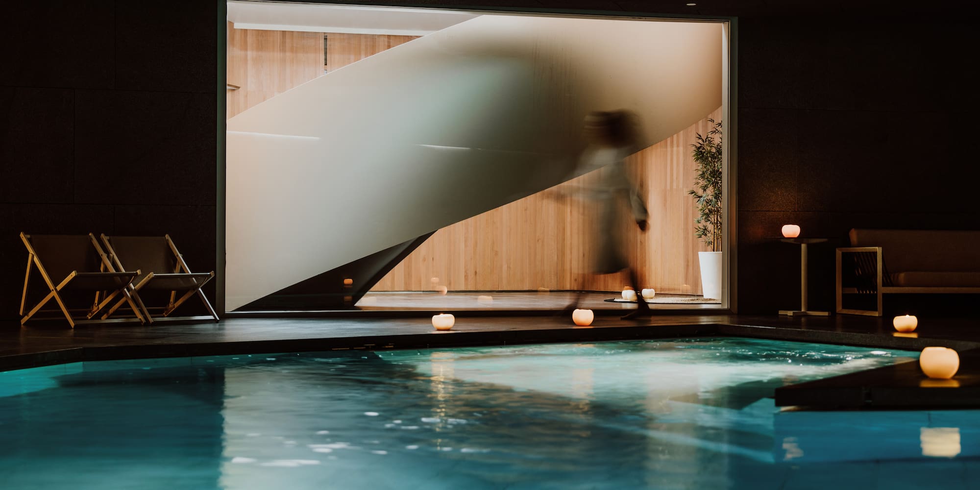 a person walking into a swimming pool