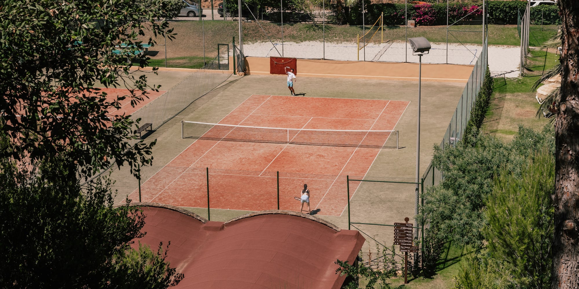 a tennis court with people on it