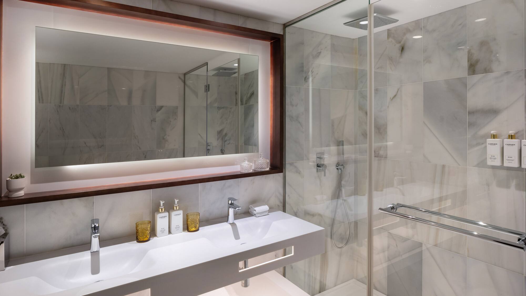 a bathroom with a mirror and a shower