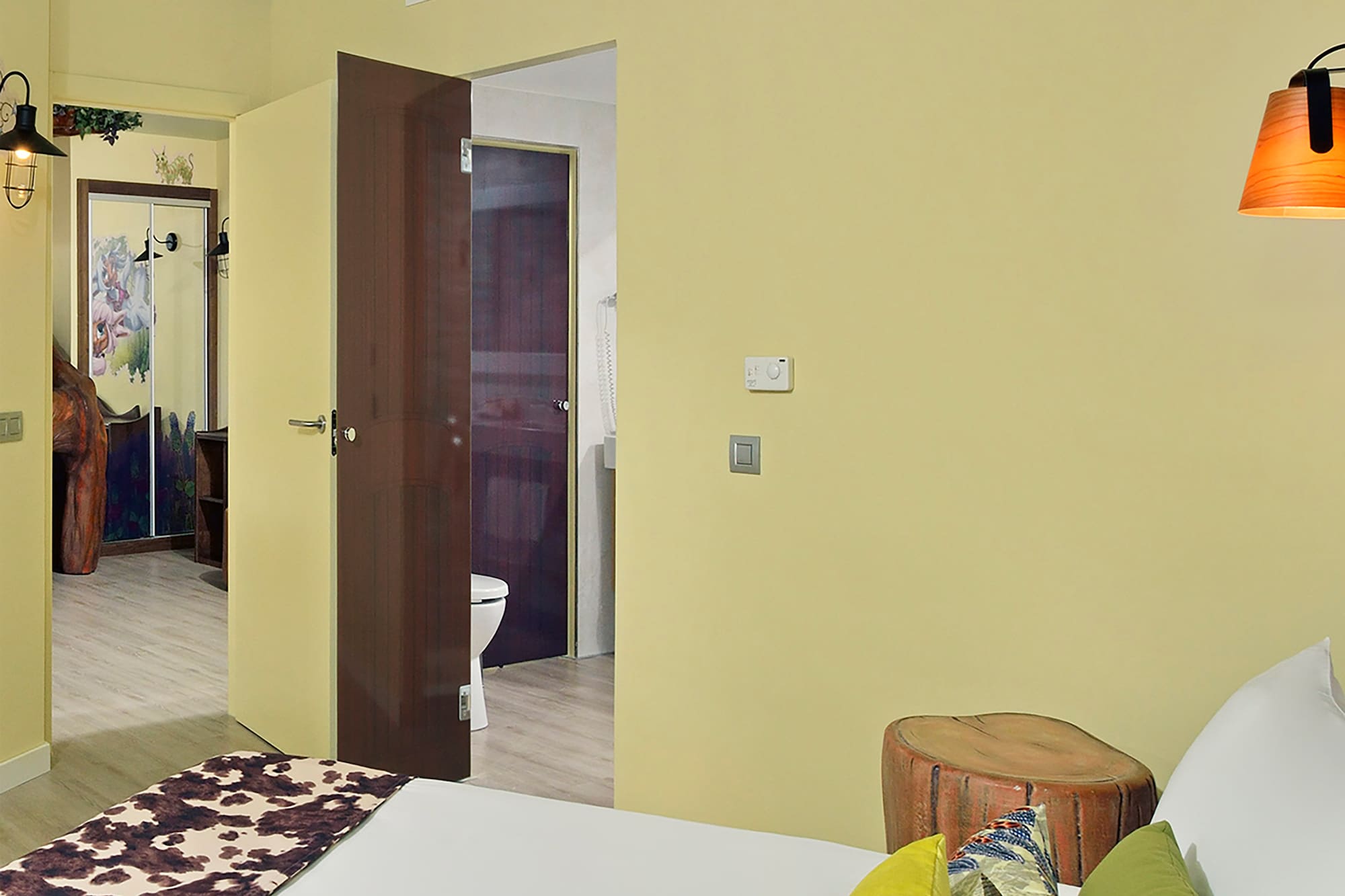 a bedroom with a bed and a door