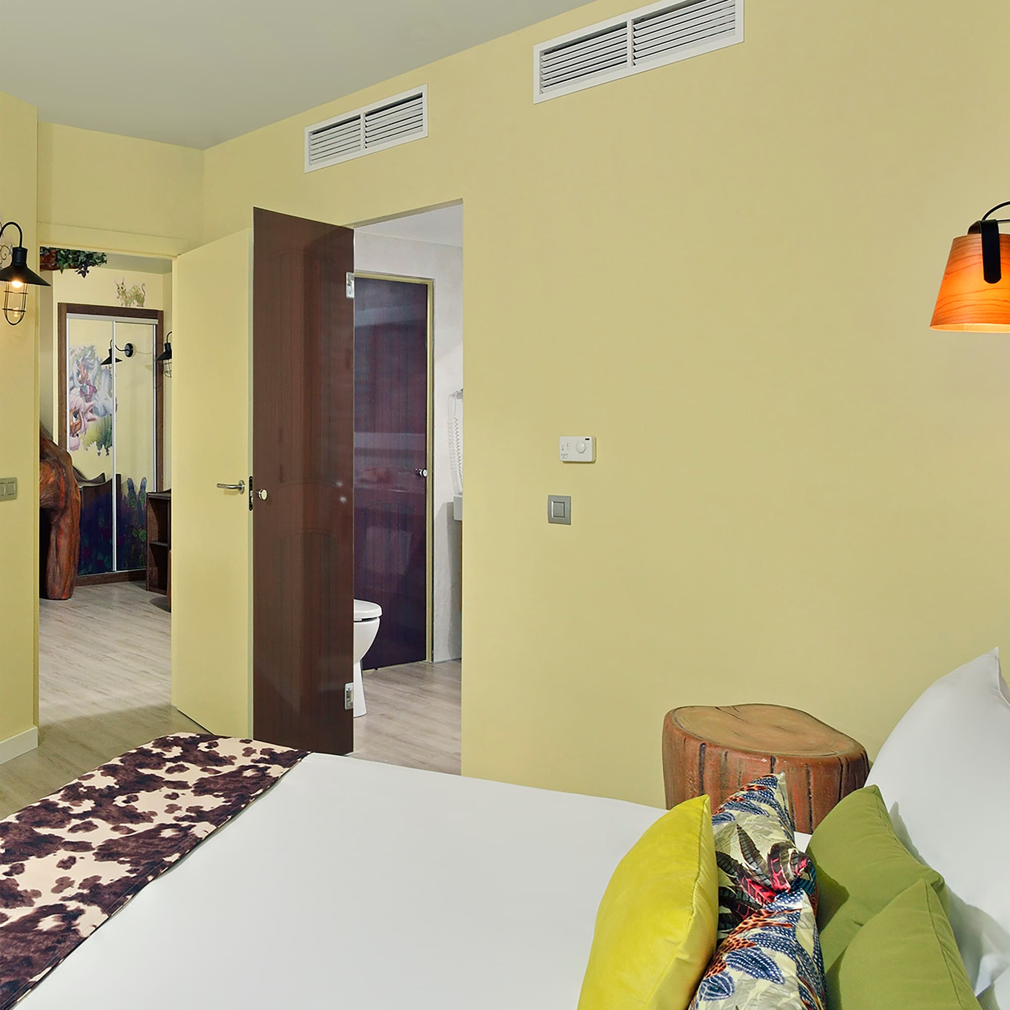 a bedroom with a bed and a door