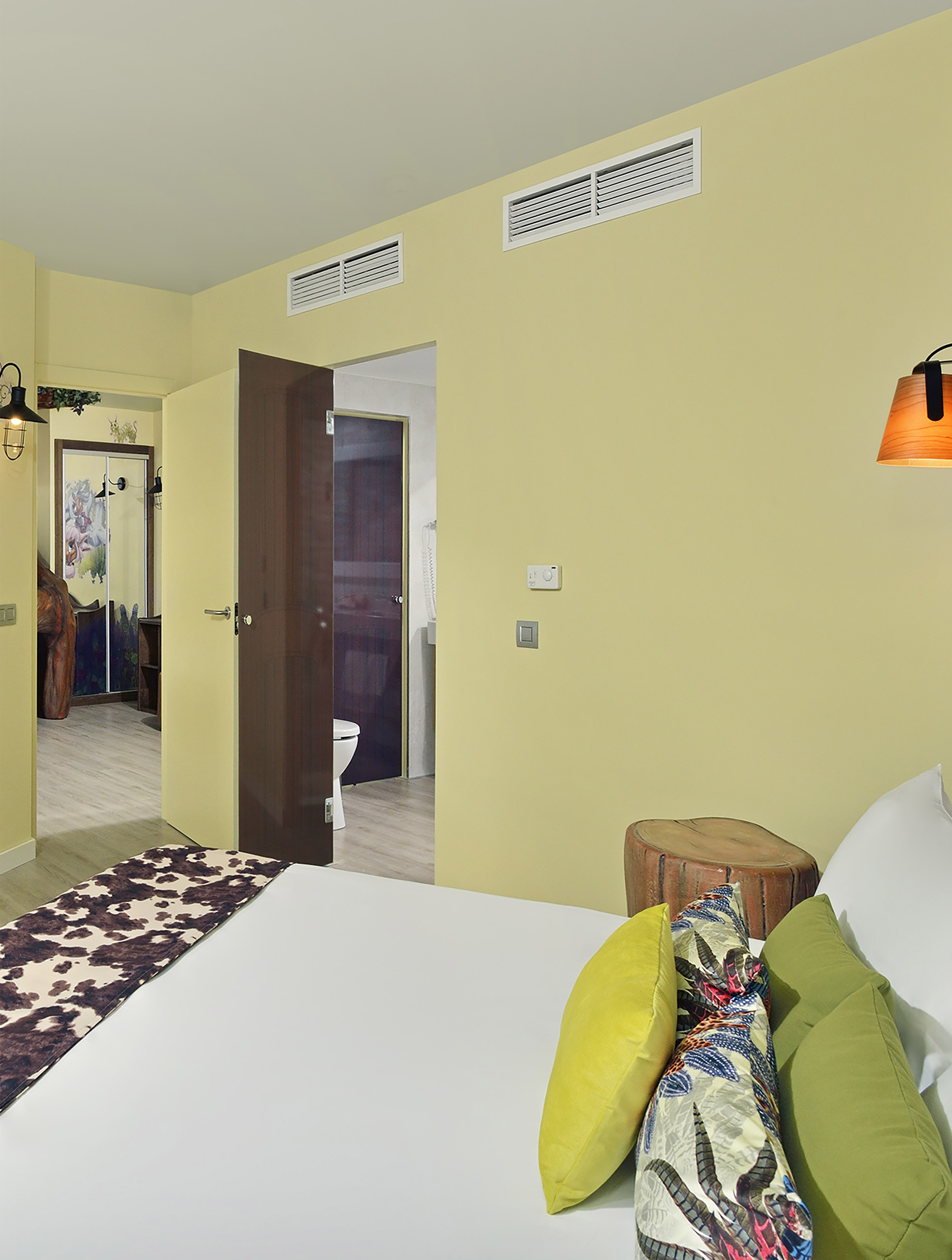 a bedroom with a bed and a door