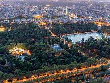 a city with trees and a lake