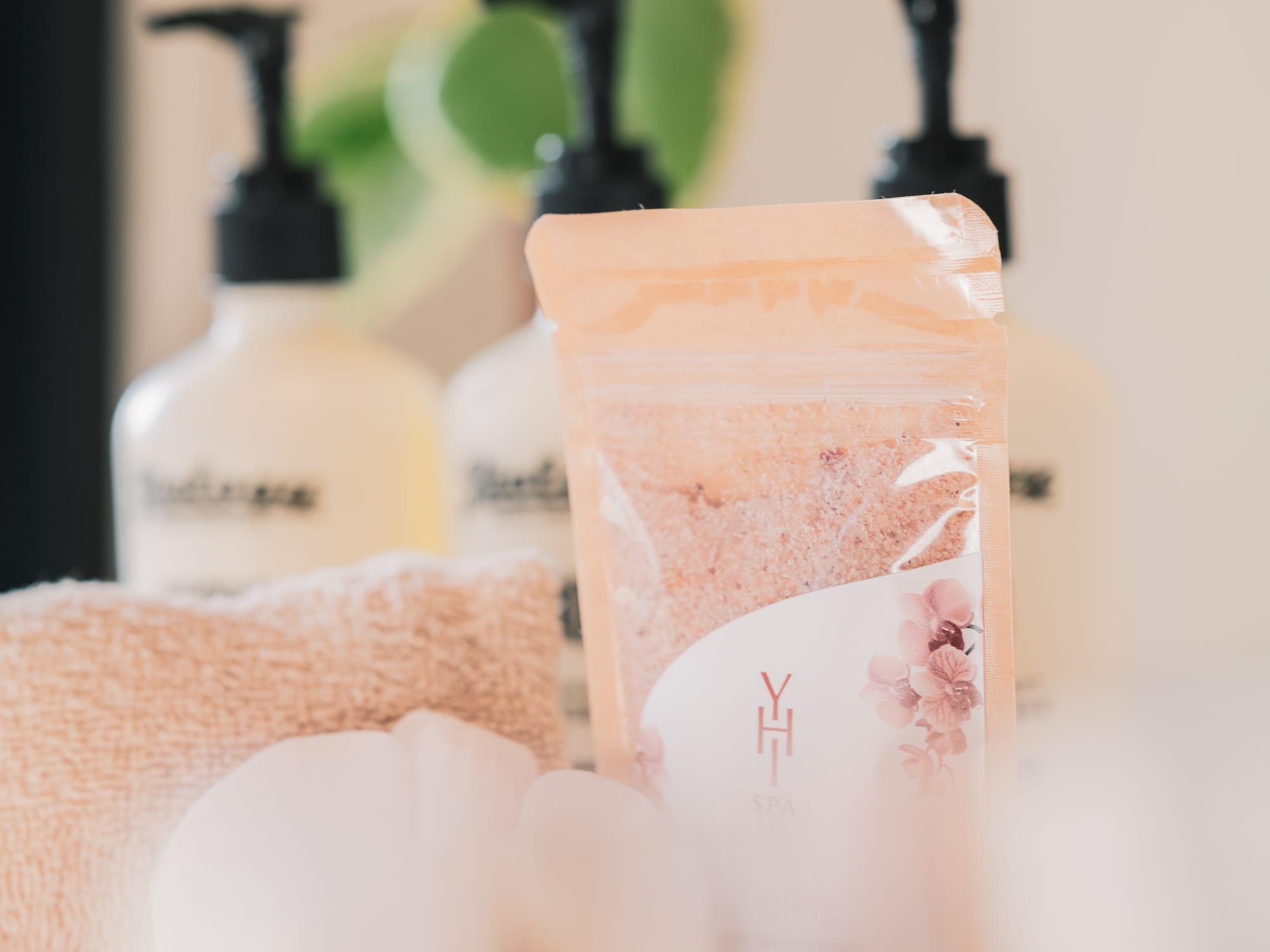 a group of bottles of soap and towels