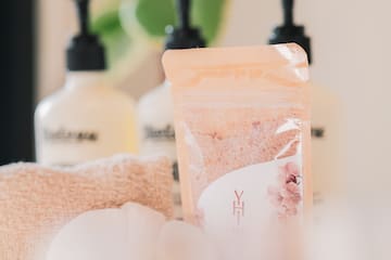 a group of bottles of soap and towels