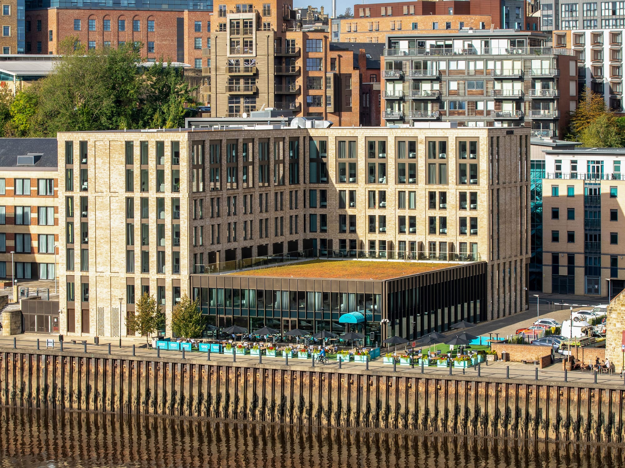 a city with many buildings and a body of water