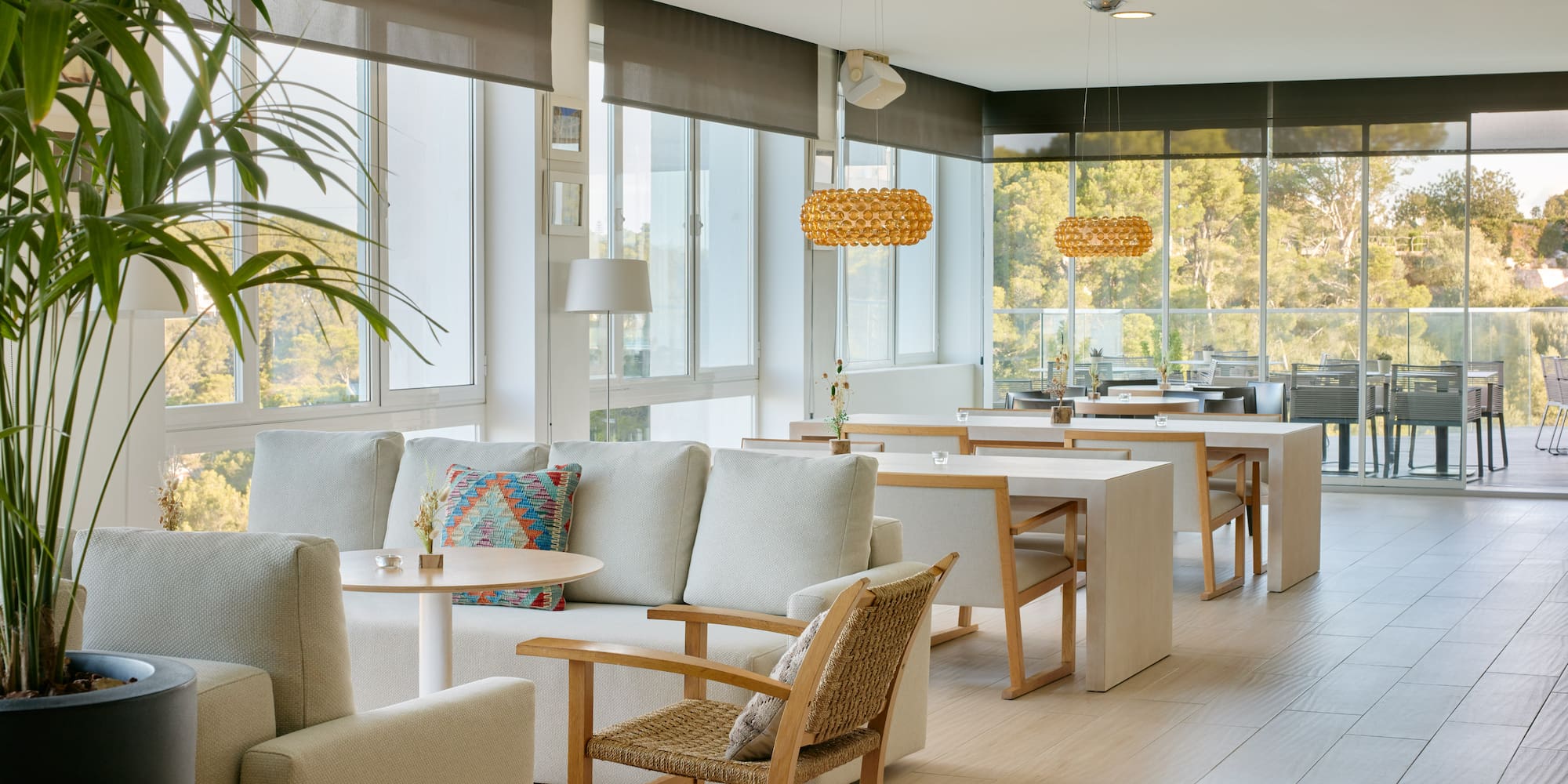 a room with white furniture and tables