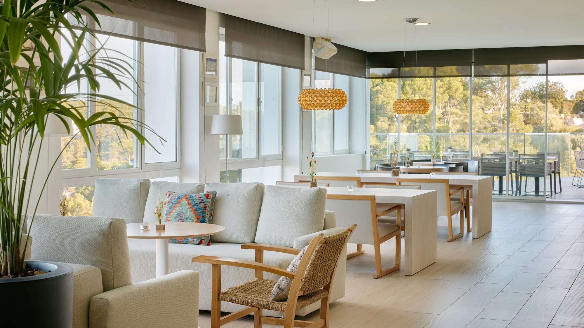 a room with white furniture and tables
