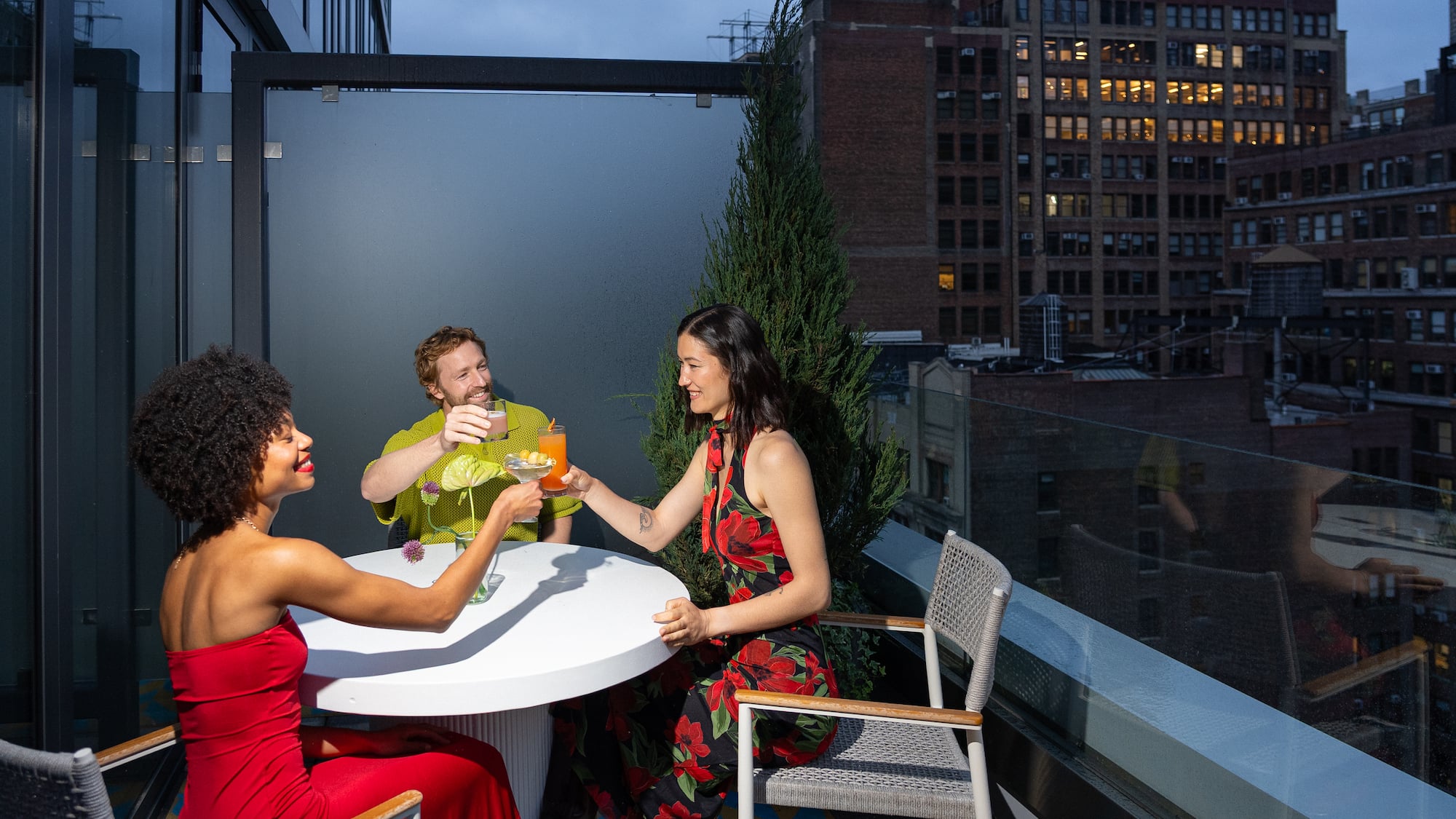 a group of people sitting at a table with drinks