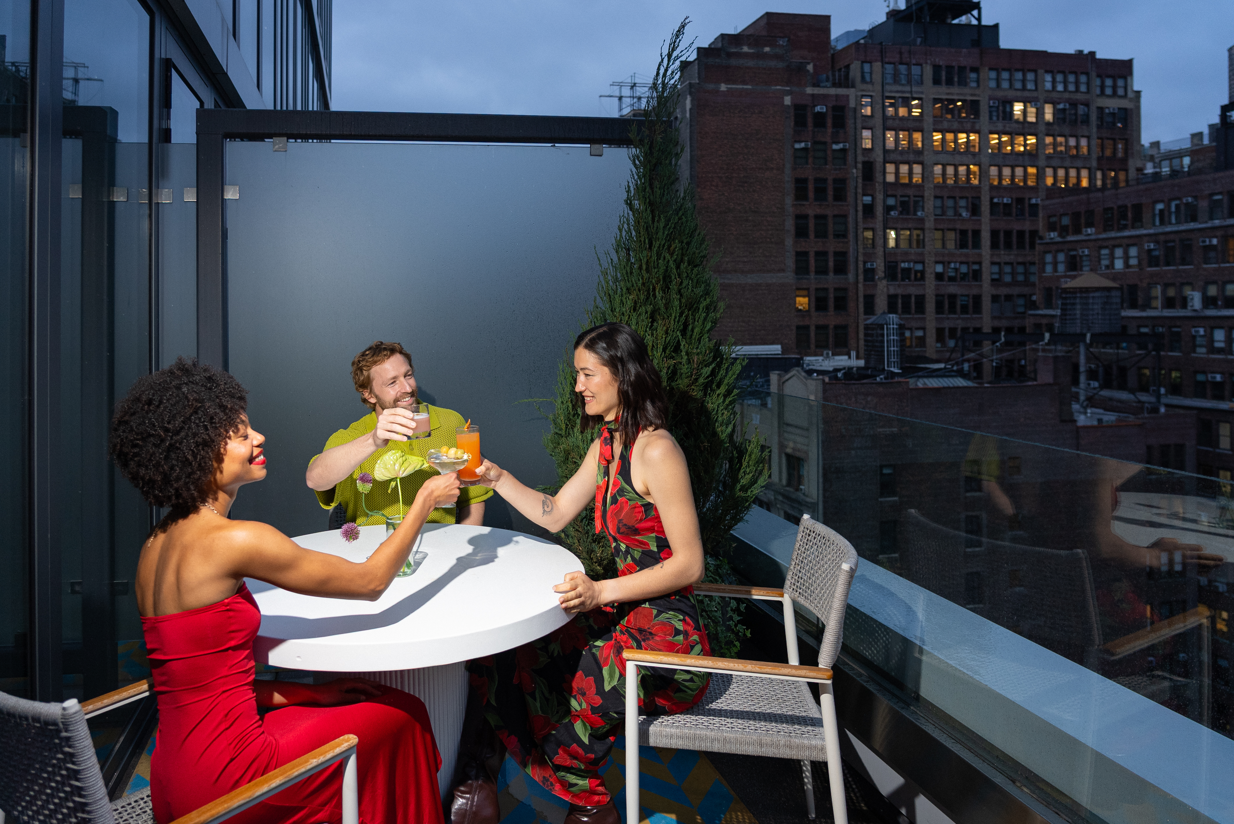 a group of people sitting at a table with drinks