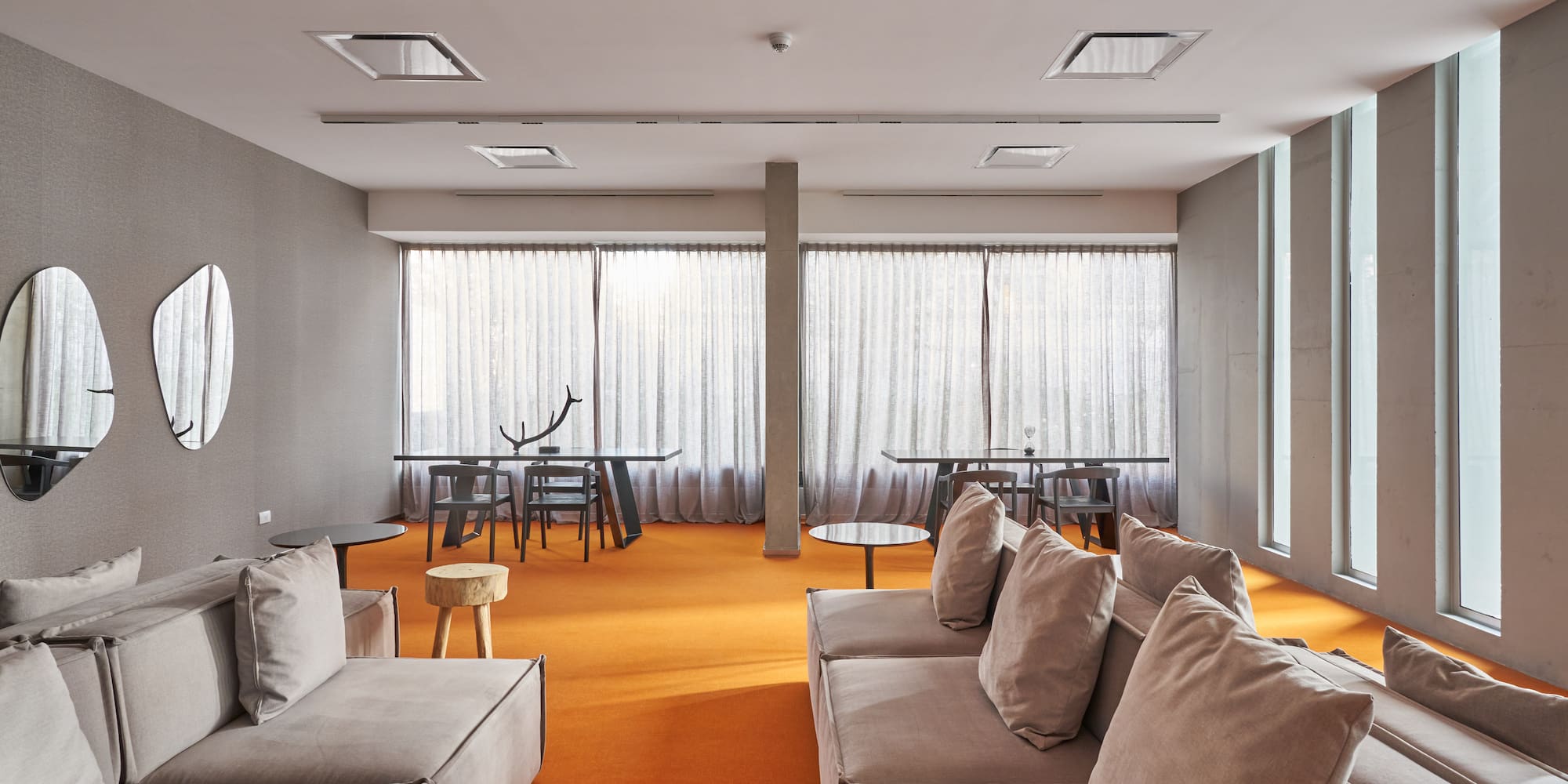 a room with couches and tables