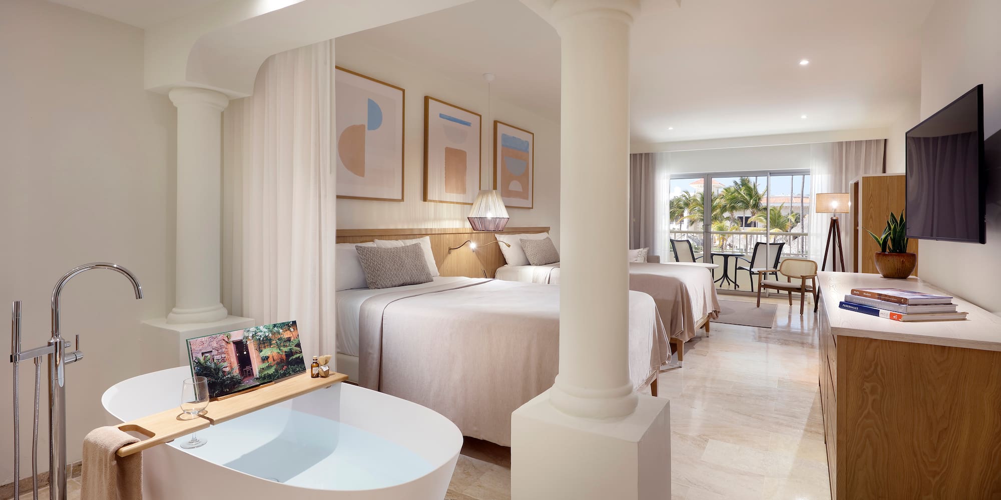 a room with two beds and a bathtub