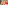 Couple smiling, playing colorful board game indoors, small dog resting.