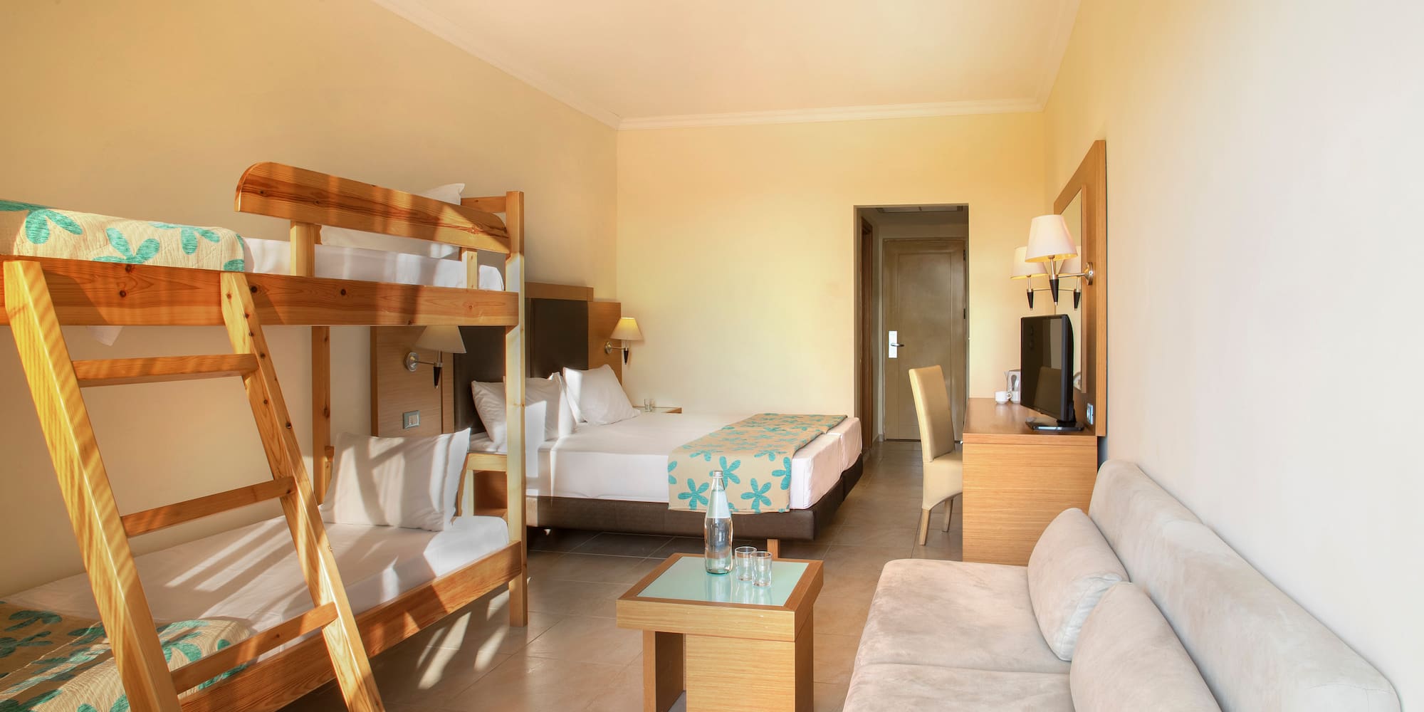 a room with bunk beds and a couch