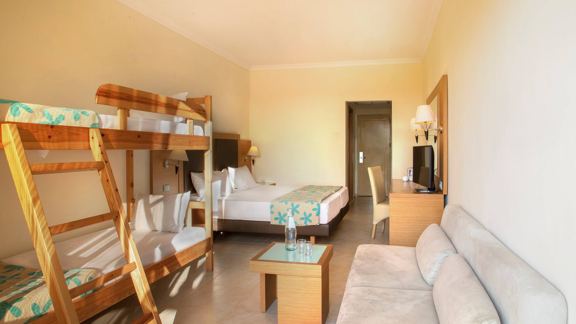 a room with bunk beds and a couch