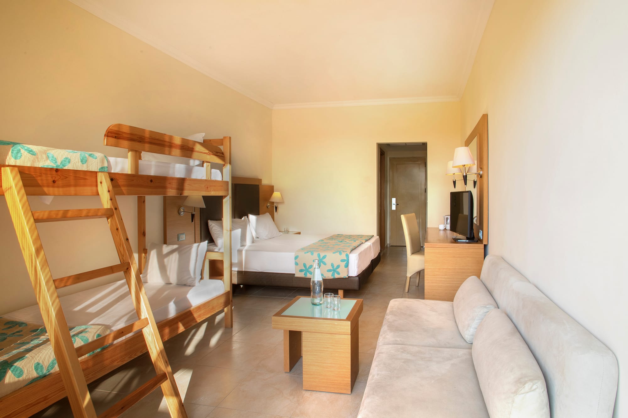 a room with bunk beds and a couch