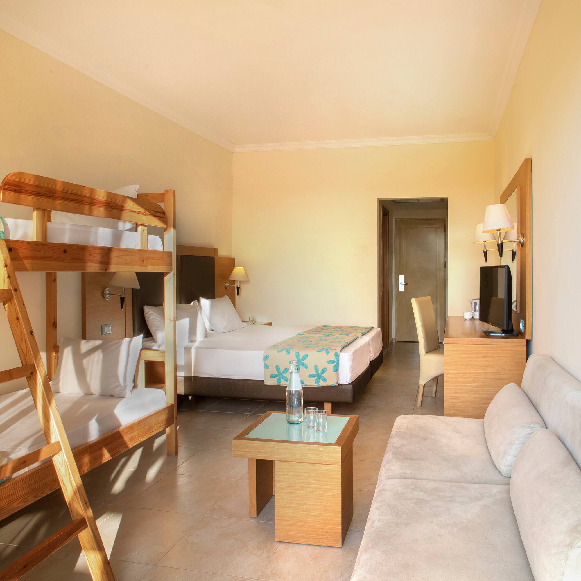 a room with bunk beds and a couch