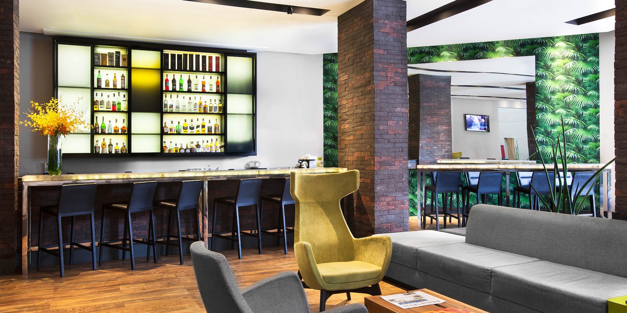 a room with a bar and a couch