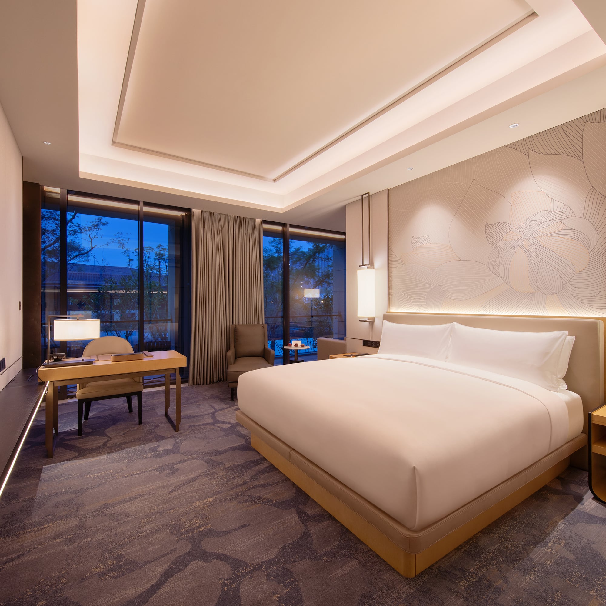 a room with a bed and a desk