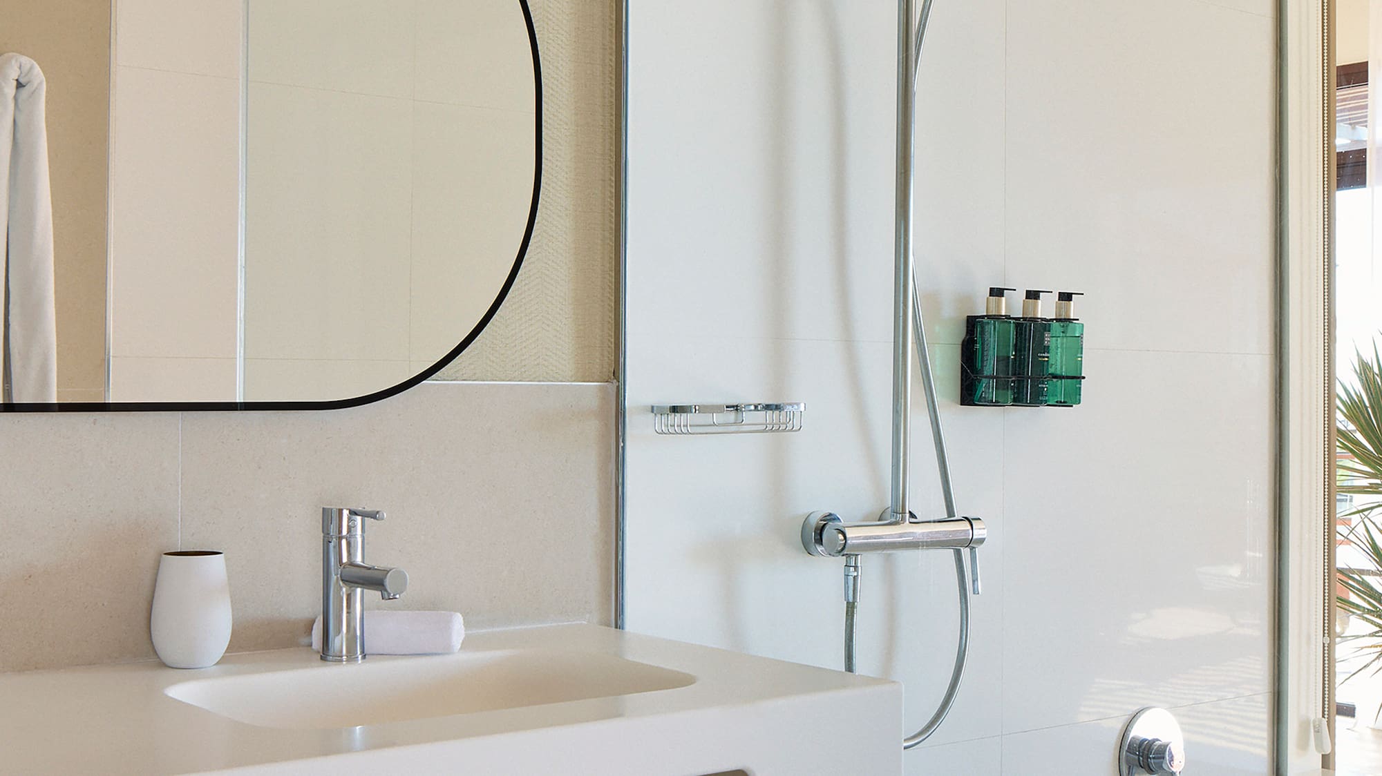a bathroom with a shower and sink