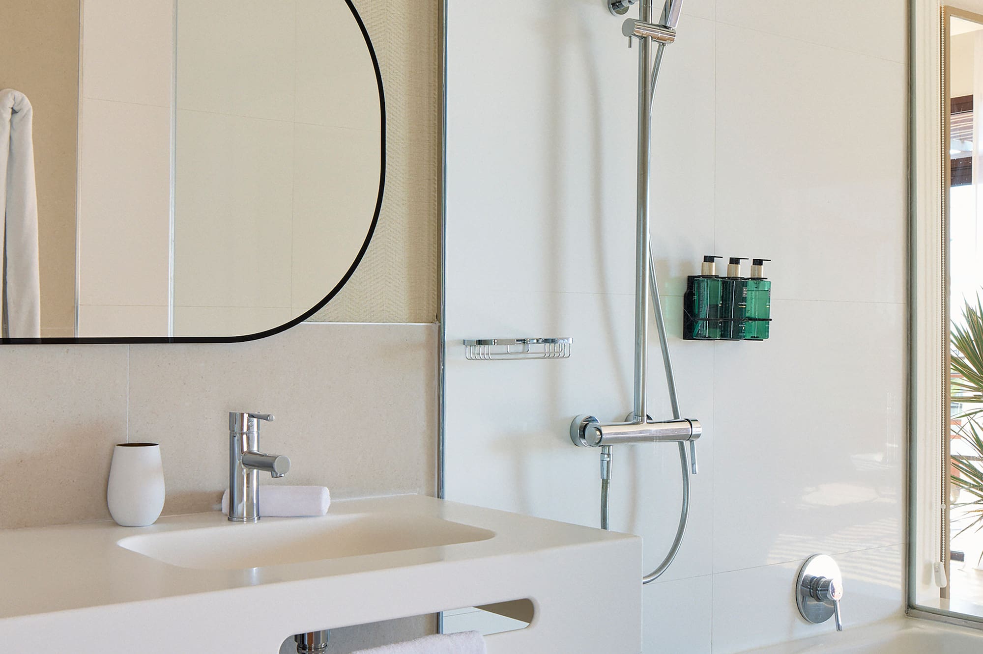 a bathroom with a shower and sink
