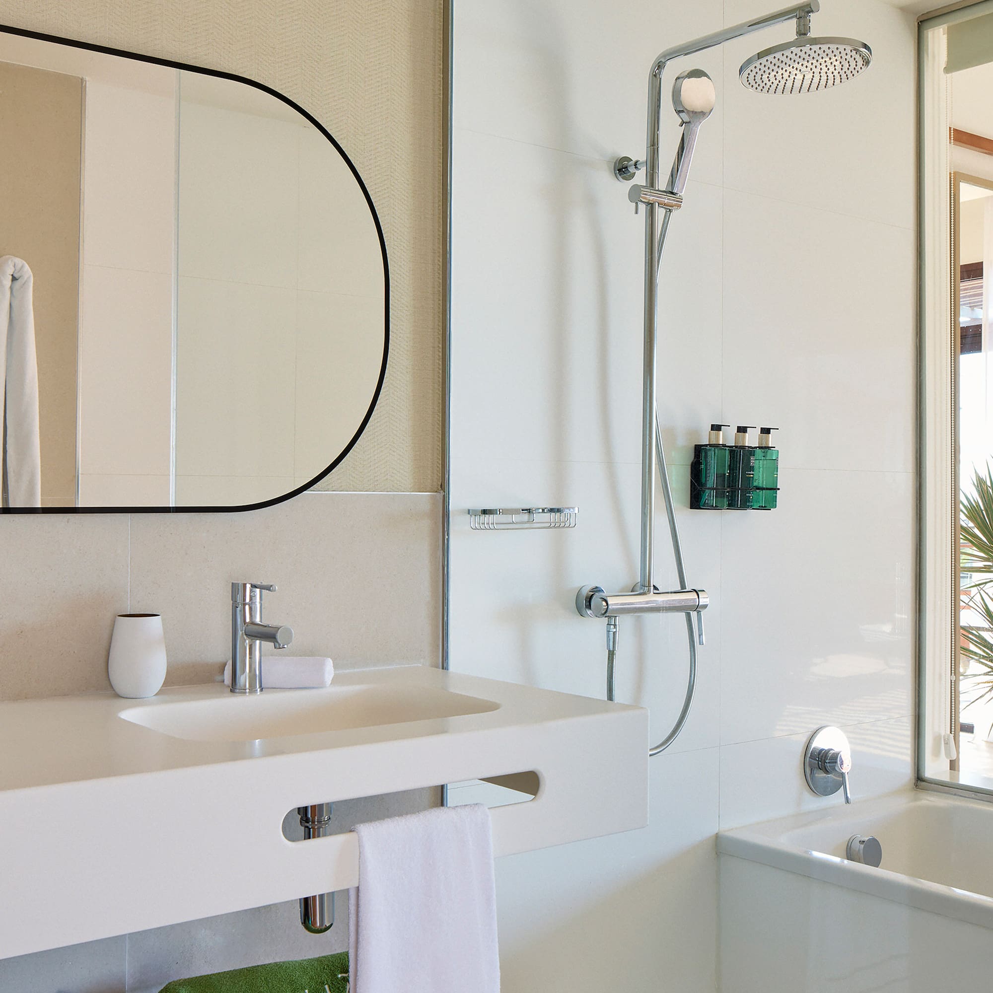 a bathroom with a shower and sink