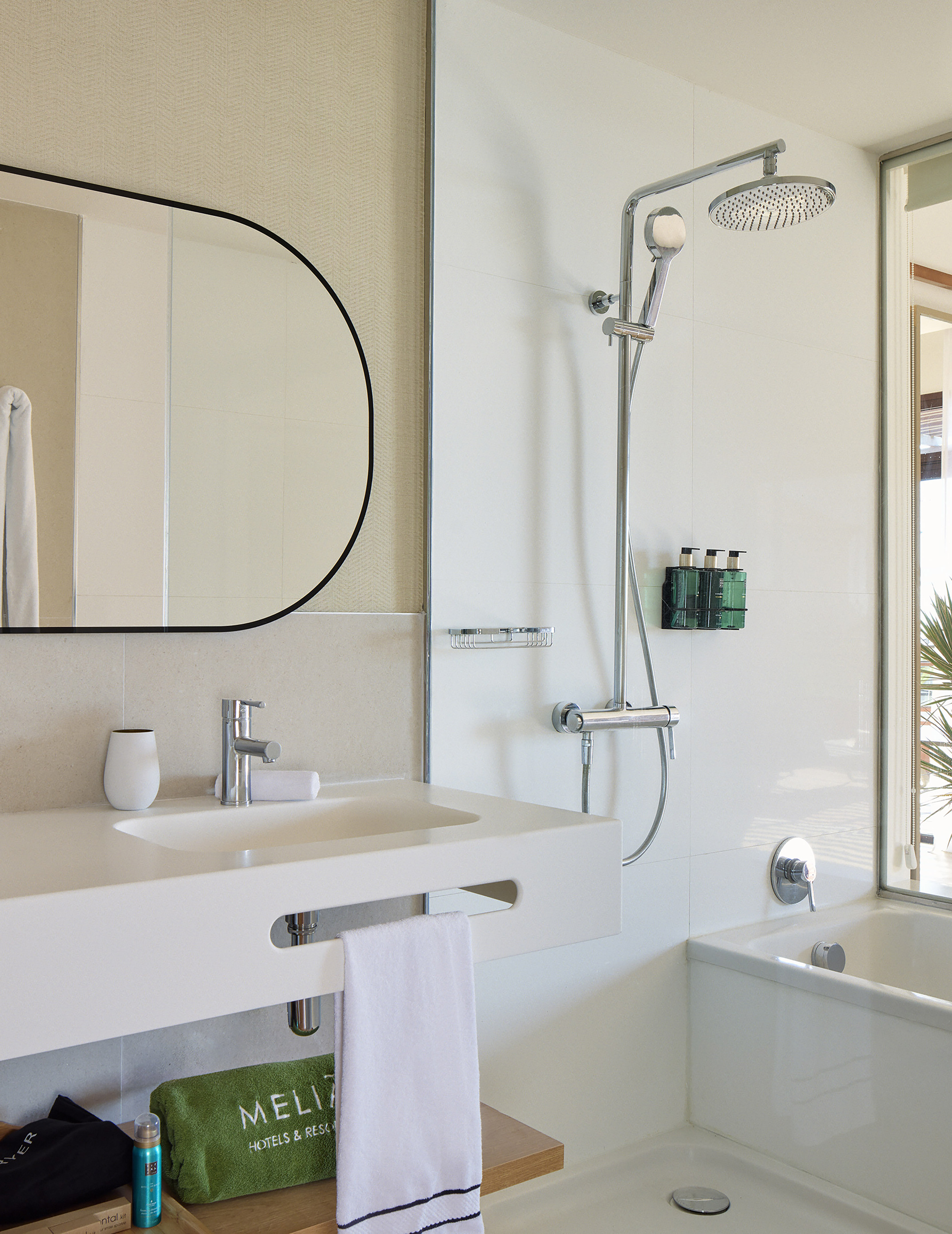 a bathroom with a shower and sink