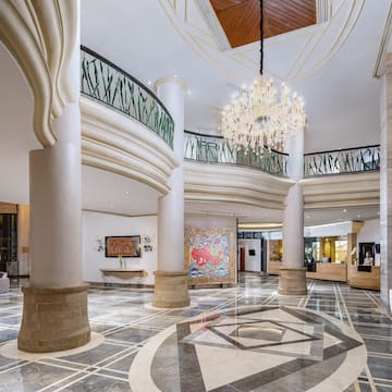 a large building with columns and a chandelier