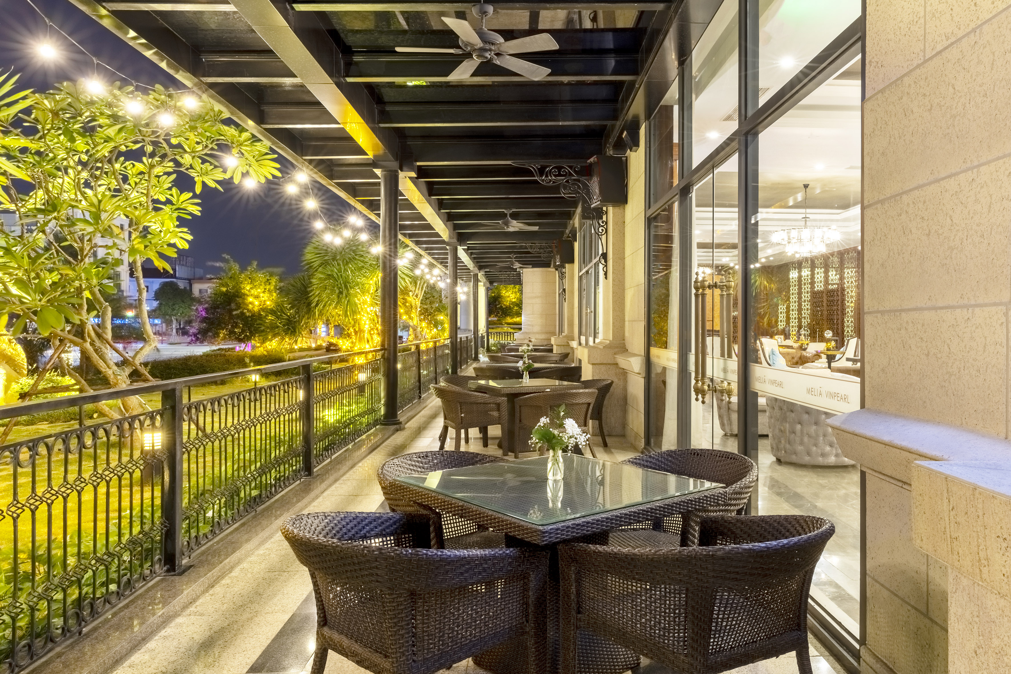 a patio with tables and chairs