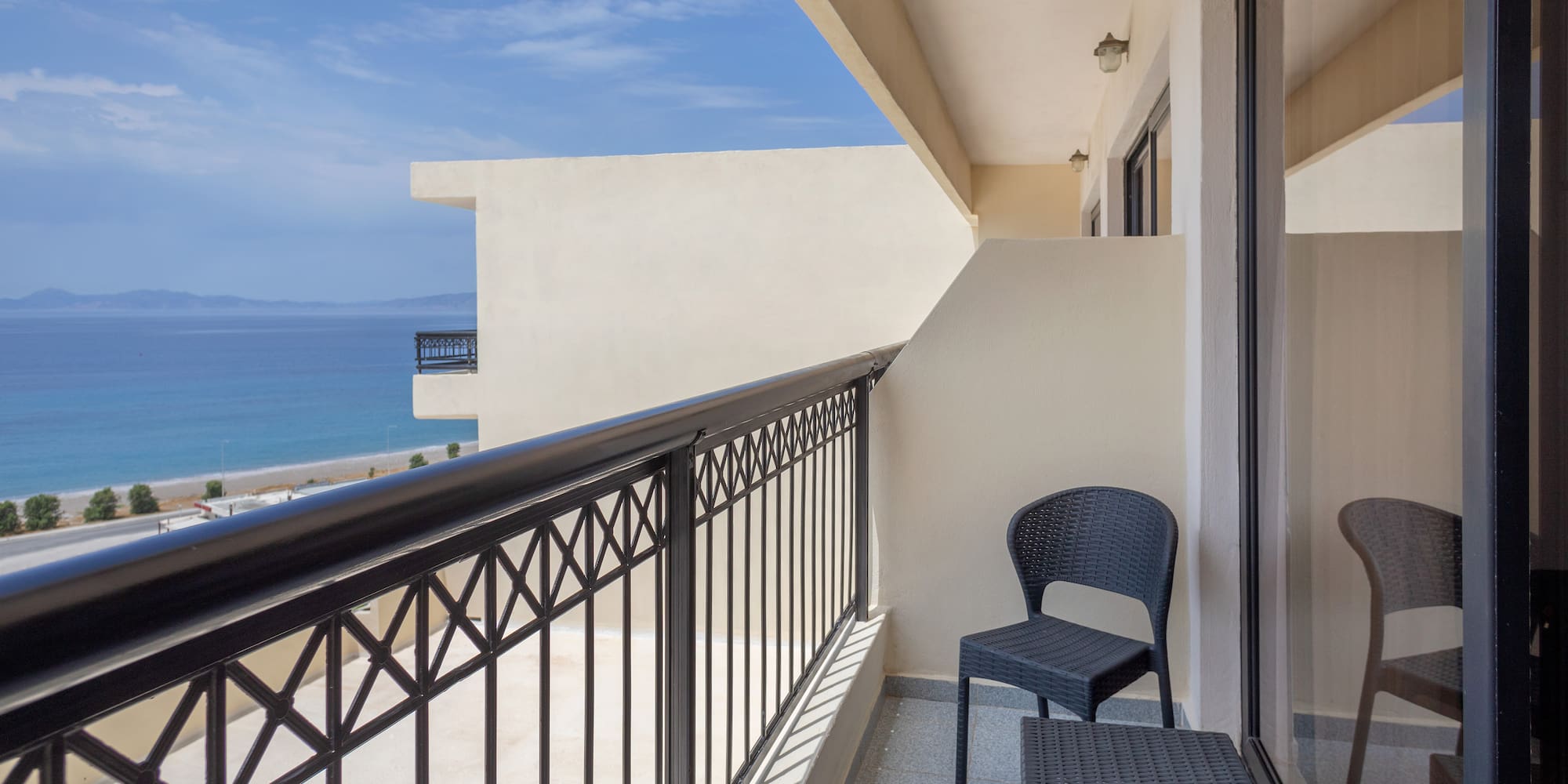 a balcony with a chair and table