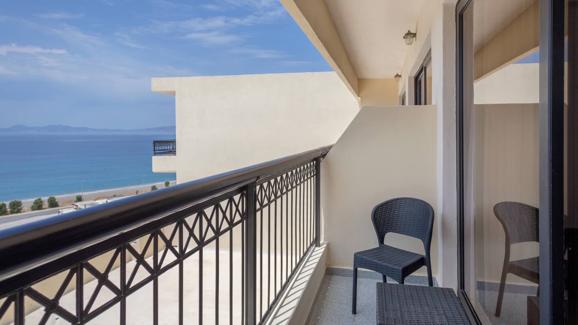 a balcony with a chair and table