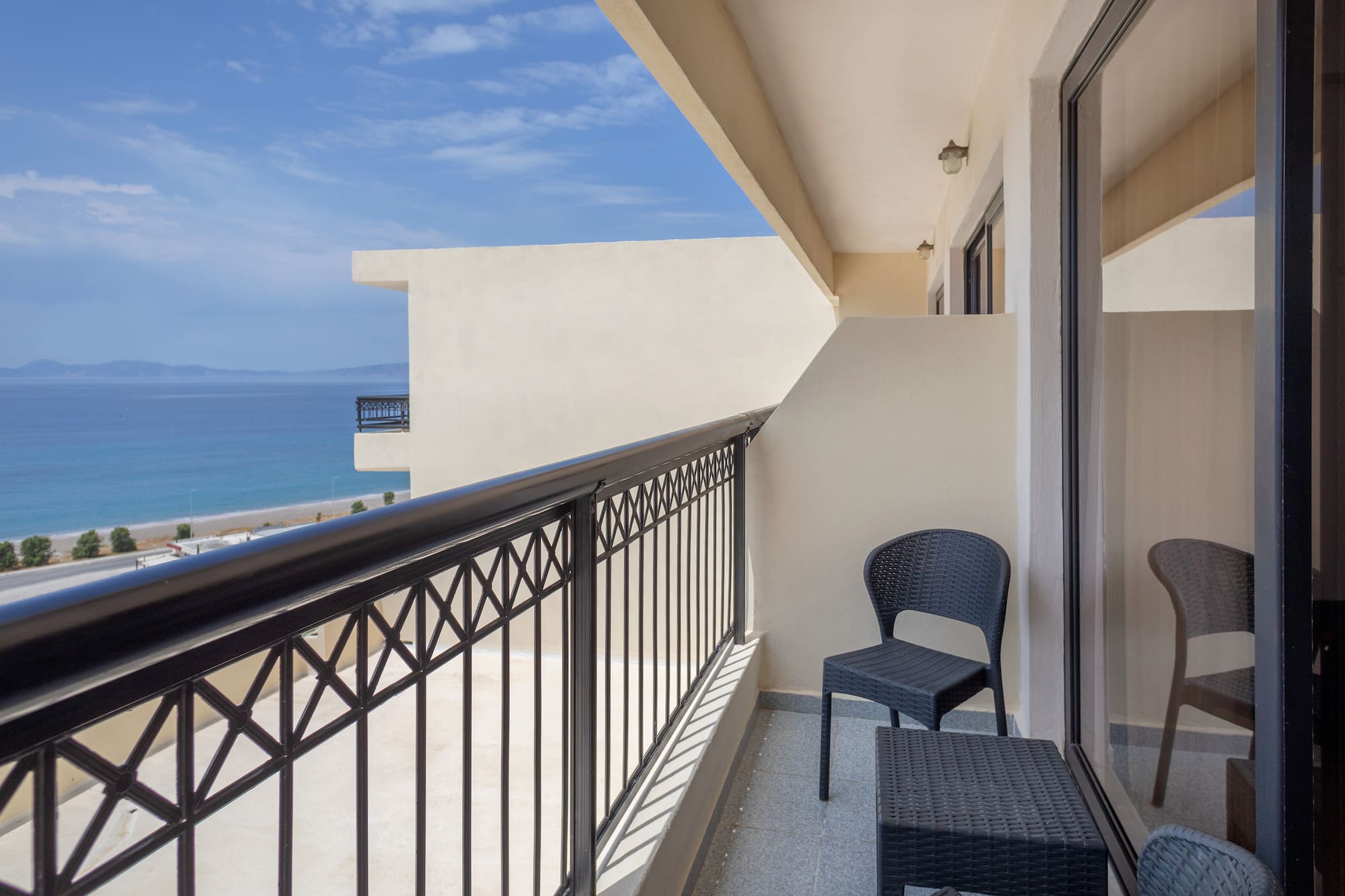 a balcony with a chair and table