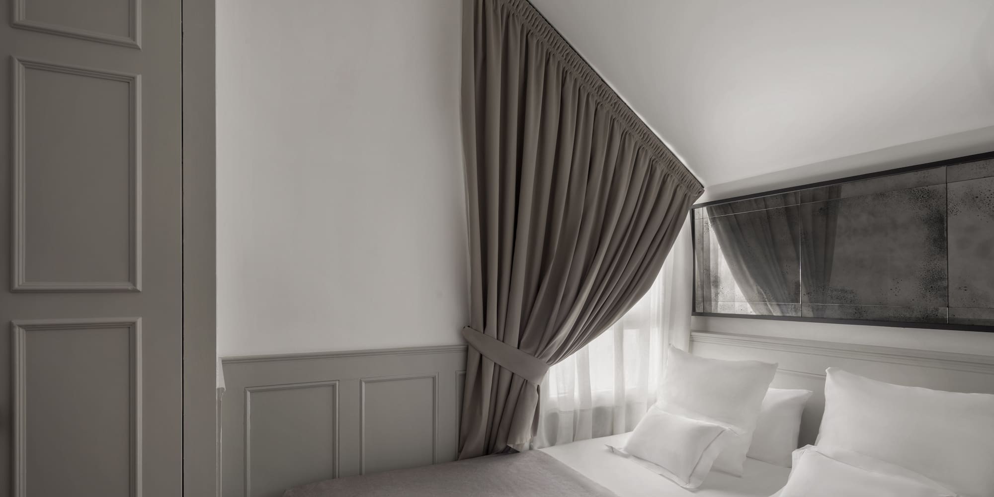 a bed with a curtain over it