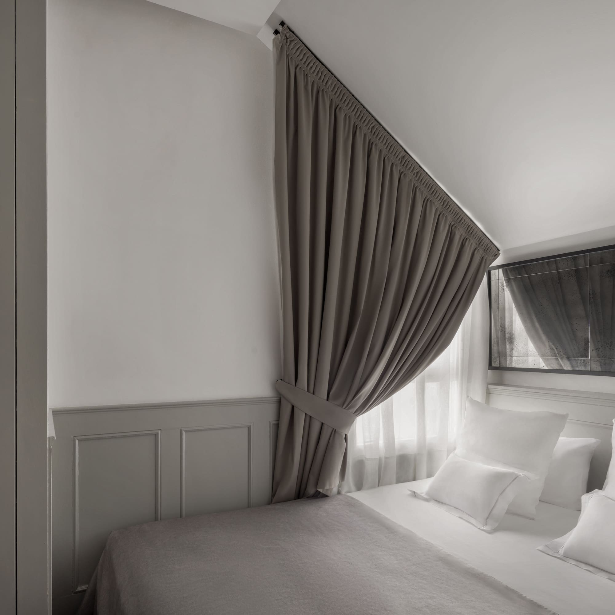 a bed with a curtain over it