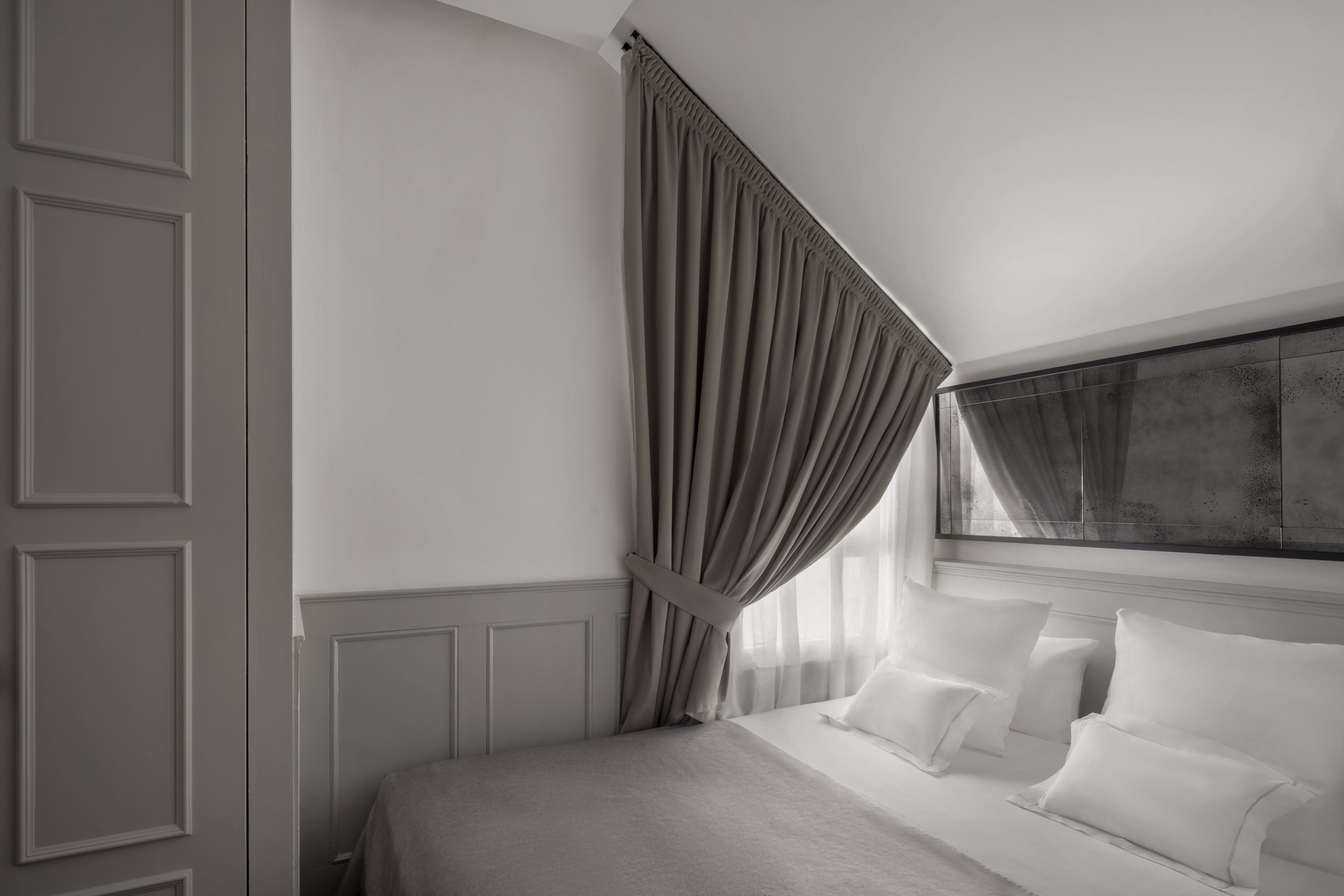 a bed with a curtain over it