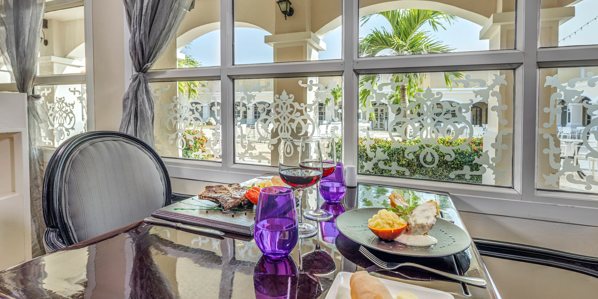 a table with food on it and glasses on it