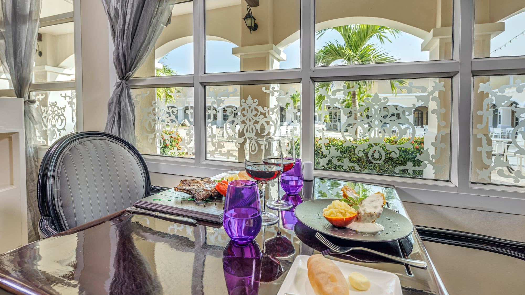 a table with food on it and glasses on it