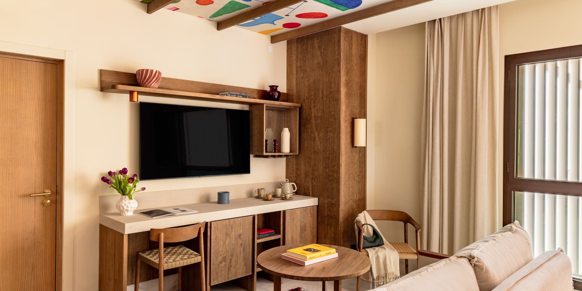 a living room with a tv and a couch