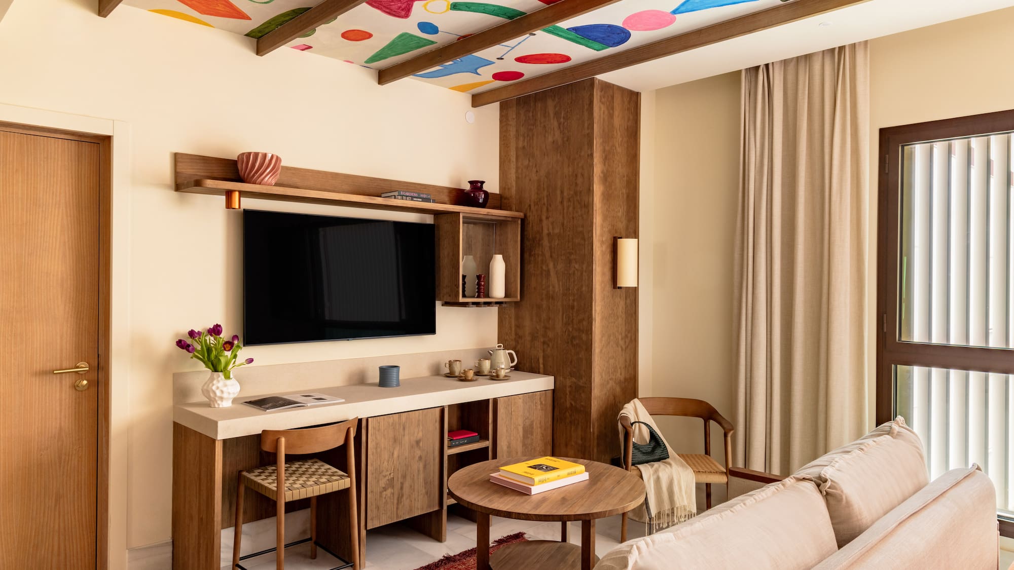 a living room with a tv and a couch