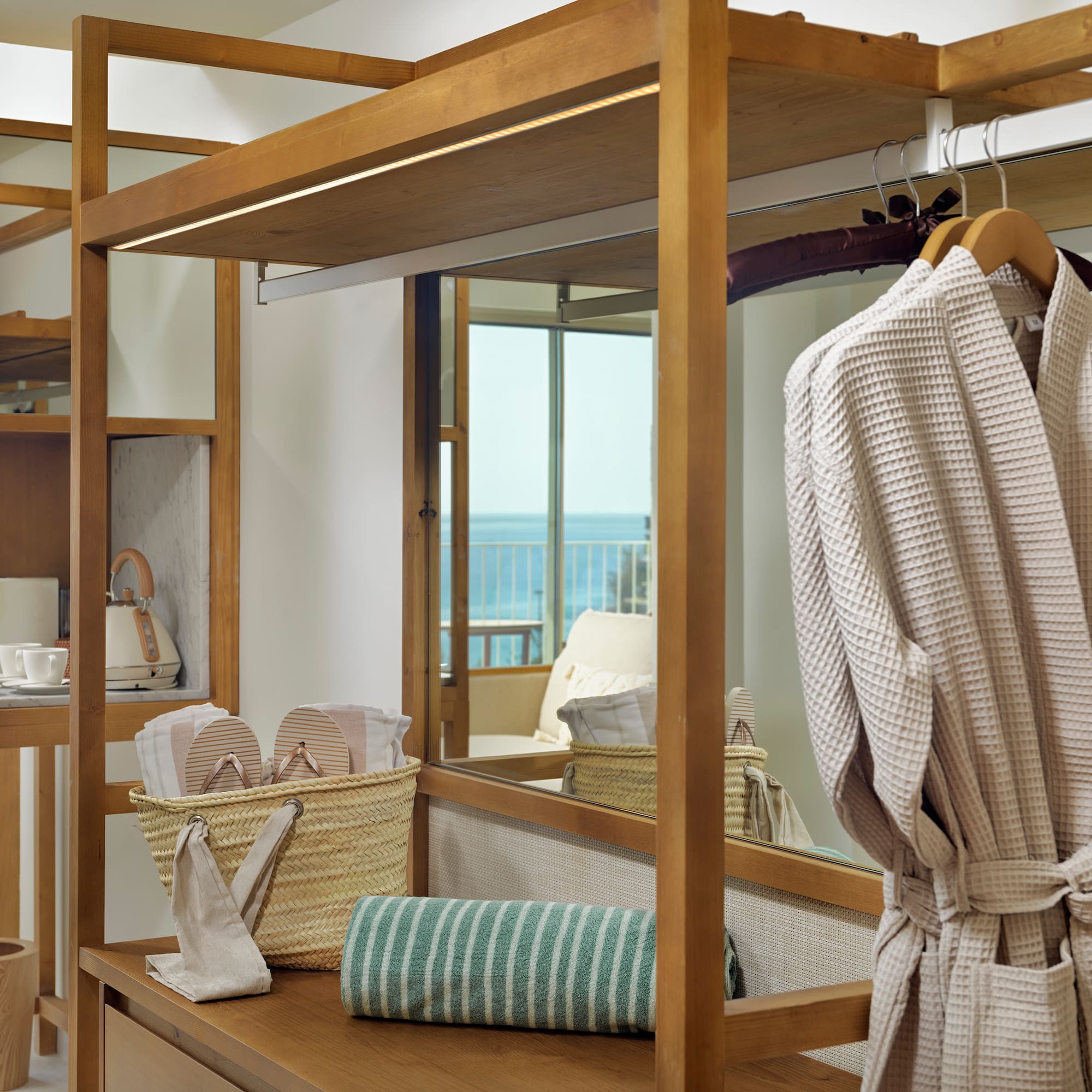 a room with a towel rack and towels
