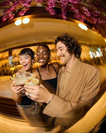 a group of people holding drinks