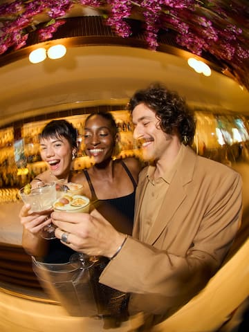 a group of people holding drinks