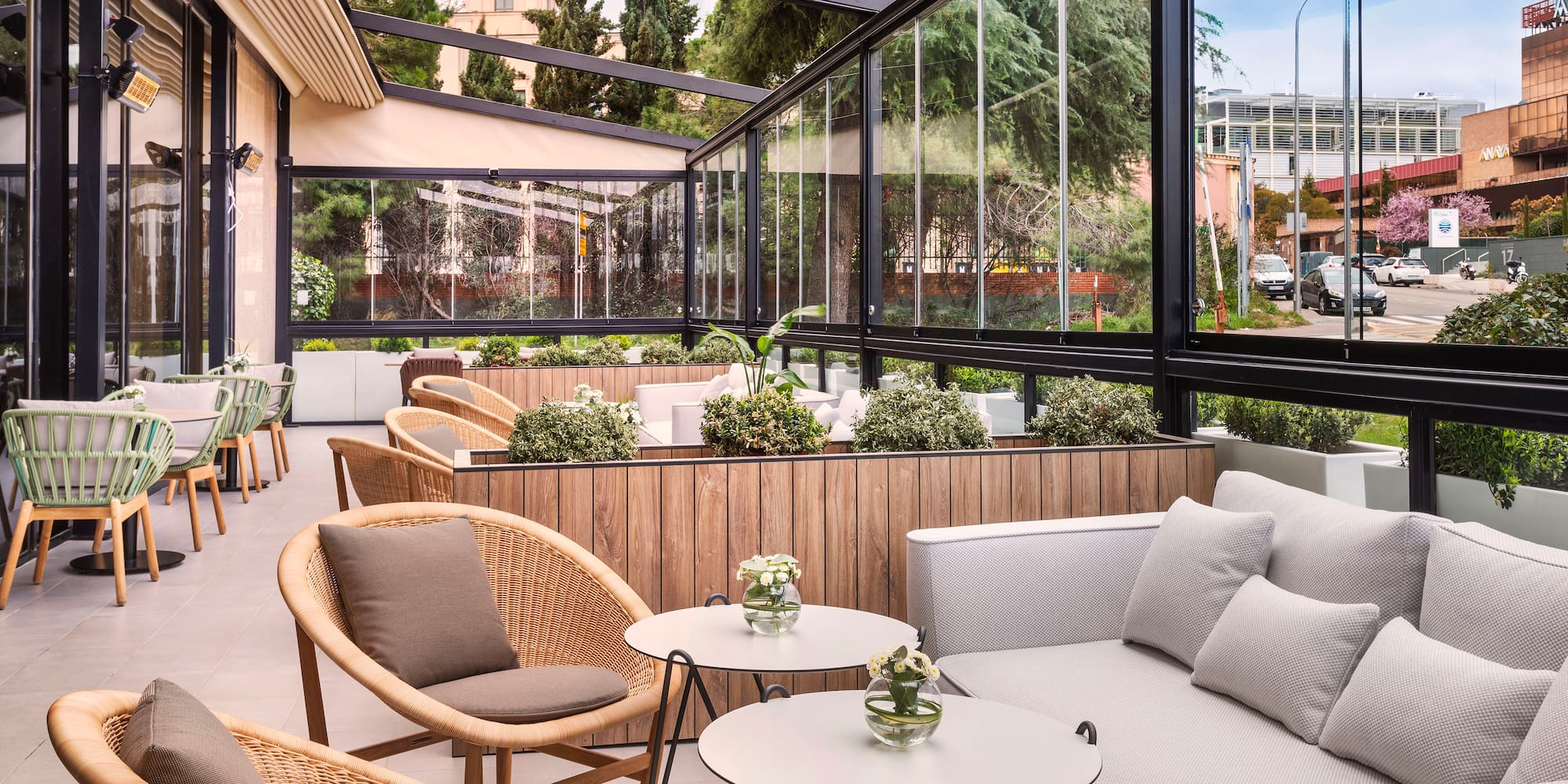 a patio with a couch and chairs